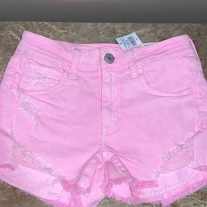 Pink slightly distressed shorts
